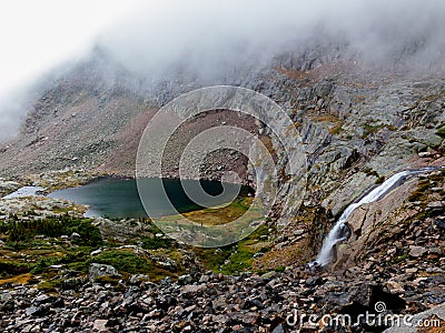 The waterfall from Chasm Lake spills into Peacock Pool Stock Photo