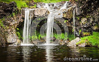 A waterfall at the Fairy Pools on the Isle of Skye in Scotland Stock Photo