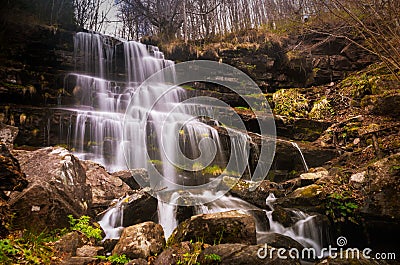 Waterfall in a forest on mountain Stock Photo