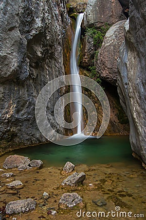 Waterfall on a green pond. Cadi, Spain. Stock Photo