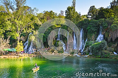 Waterfall Kravica in the light of the setting sun Stock Photo