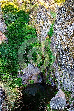 Waterfall in Manteigas Town, Serra da Estrela or Mountain of Star in Portugal called Poco do Inferno or Hell Pit Stock Photo