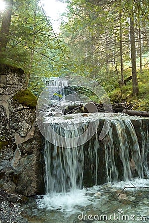 Waterfall at mountain hiking tour to Tegelberg mountain, Bavaria, Germany Stock Photo