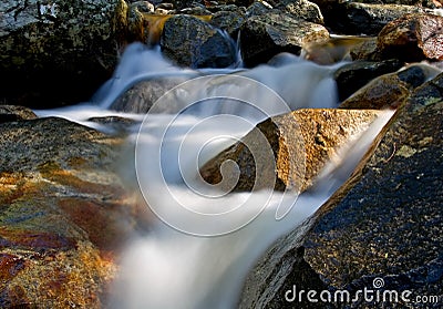 Waterfall movement on the rocks Stock Photo