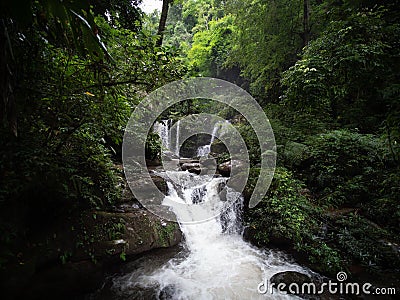 Waterfall in Nan, Thailand. Waterfalls in green rain forest. Stream from waterfall. Stock Photo