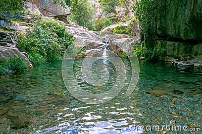 waterfall and natural pool in the uninhabited village of Drave, the most isolated village in Portugal. Stock Photo