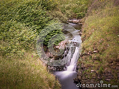 Waterfall near Blackpool beach near Hartland Quay, view looking inland. North Devon AONB. Stock Photo