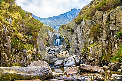 Waterfall near Llyn Idwal a small lake that lies within Cwm Idwal Stock Photo