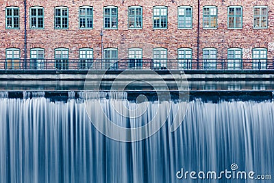 Waterfall in the old industrial area in Norrkoping, Sweden Stock Photo