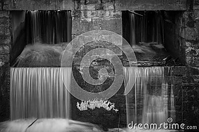 The waterfall out dam of city pond in Bueckeburg, Germany Stock Photo