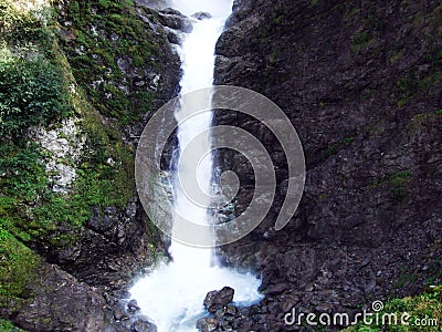 Waterfall Stauber or Wasserfall StÃ¤uber, Brunnibach stream in the Alpine Valley of Maderanertal Stock Photo