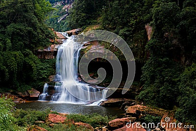 Waterfall and stream in forest Stock Photo