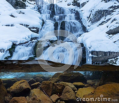 Waterfall in the winter in the Carpathian mountains Stock Photo