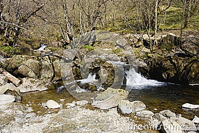 Waterfalls on Aira Beck as it flows through woodland Stock Photo