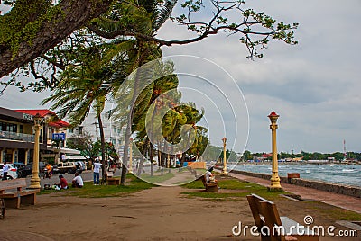 Waterfront with beautiful trees in cloudy weather. Dumaguete, Philippines Editorial Stock Photo