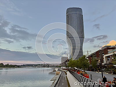 Waterfront with benches, people, and Kula Belgrade Editorial Stock Photo