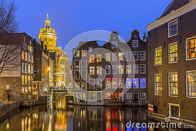 Waterfront canal houses at twilight Amsterdam Stock Photo