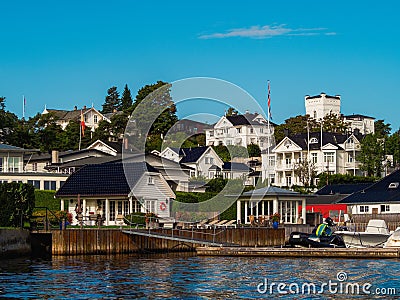 Waterfront view on a white houses on a shore in Oslo fjord. Norwegian detached houses Stock Photo