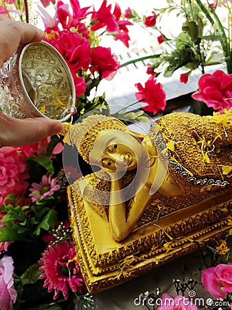 Watering Buddha In the Songkran festival Stock Photo
