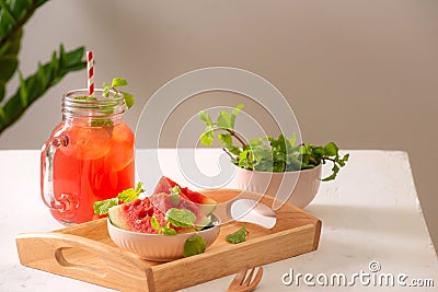 Watermelon drink in glass with slices of watermelon on whitebackground Stock Photo