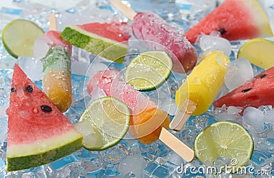 Watermelon, fruit popsicle and lime slices Stock Photo