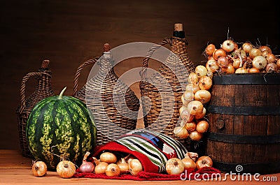 Watermelon, onion, wooden barrel and woolen bag Stock Photo