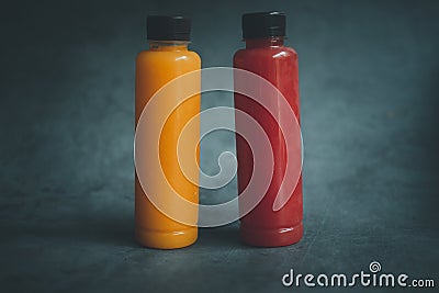 Watermelon and orange juice packed in plastic bottles Stock Photo