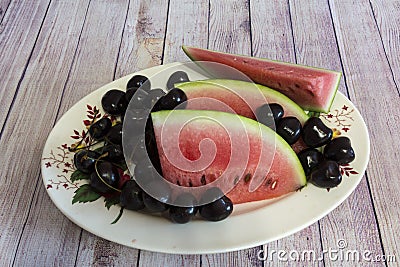 Watermelon slices and cherries Stock Photo