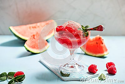 Watermelon sorbet or granita, refreshing summer dessert with strawberries Stock Photo