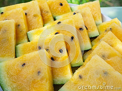 Watermelon, yellow, cut into triangles, close up. Summer refreshment Stock Photo