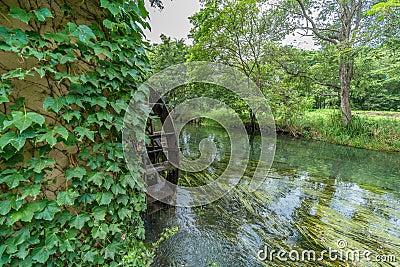 Watermill by Sai river (Sai-Gawa) near Daio Wasabi Farm in Azumino Stock Photo