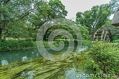 Watermill by Sai river (Sai-Gawa) near Daio Wasabi Farm in Azumino Stock Photo