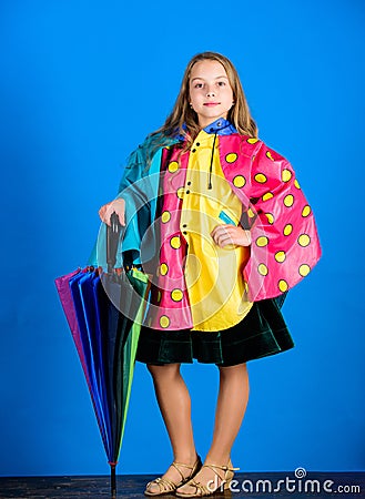 Waterproof accessories make rainy day cheerful and pleasant. Waterproof accessories manufacture. Kid girl happy hold Stock Photo