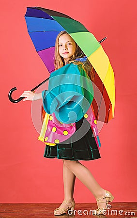 Waterproof accessories manufacture. Waterproof accessories make rainy day cheerful and pleasant. Kid girl happy hold Stock Photo