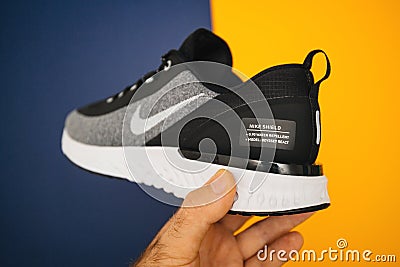 Waterproof and windproof running shoe Nike Odyssey React in hand Editorial Stock Photo