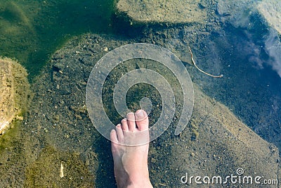 The waters of the basalt lake, the stones in the lake are covered with algae, clear and pure water Stock Photo