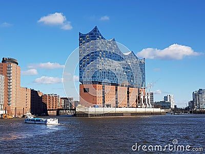 Waterside view of the Elbphilharmonie Hamburg concert hall building before the blue skyline Editorial Stock Photo