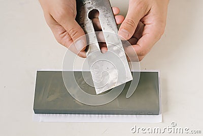 Waterstone sharpening of a planer blade of a handplane Stock Photo