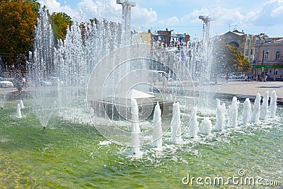 Waterworks fountain with water sprays and geysers on city park or street. Autumn day time freshness and relax concept. Clear aqua Editorial Stock Photo