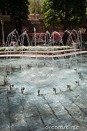 Waterworks fountain with water sprays and geysers in park or garden Stock Photo