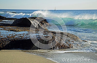 Wave crashing on rocks at Aliso Beach in Laguna Baech, California. Stock Photo