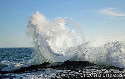 Wave crashing on rocks at West Street Beach in South Laguna Beach,California. Stock Photo