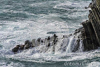 Wave hitting a waterblock in Italy - Riomaggiore Stock Photo