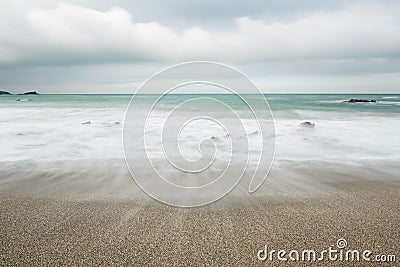 Wave over Shingle, Towan Head, Fistral, Newquay, Cornwall Stock Photo