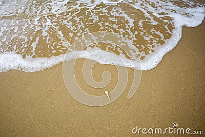 Wave on the sand beach Stock Photo