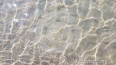 Wave of the sea with bubble and sunlight effect on sand beach Stock Photo