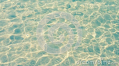 Wave of the sea with bubble and sunlight effect on sand beach Stock Photo