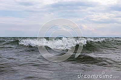 Sea wave hitting the shore Stock Photo