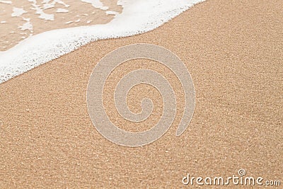 Wave of sea on sandy beach Stock Photo