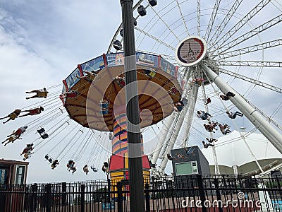 Wave Swinger Ride and Ferris Wheel, Navy Pier, Chicago, Illinois Editorial Stock Photo